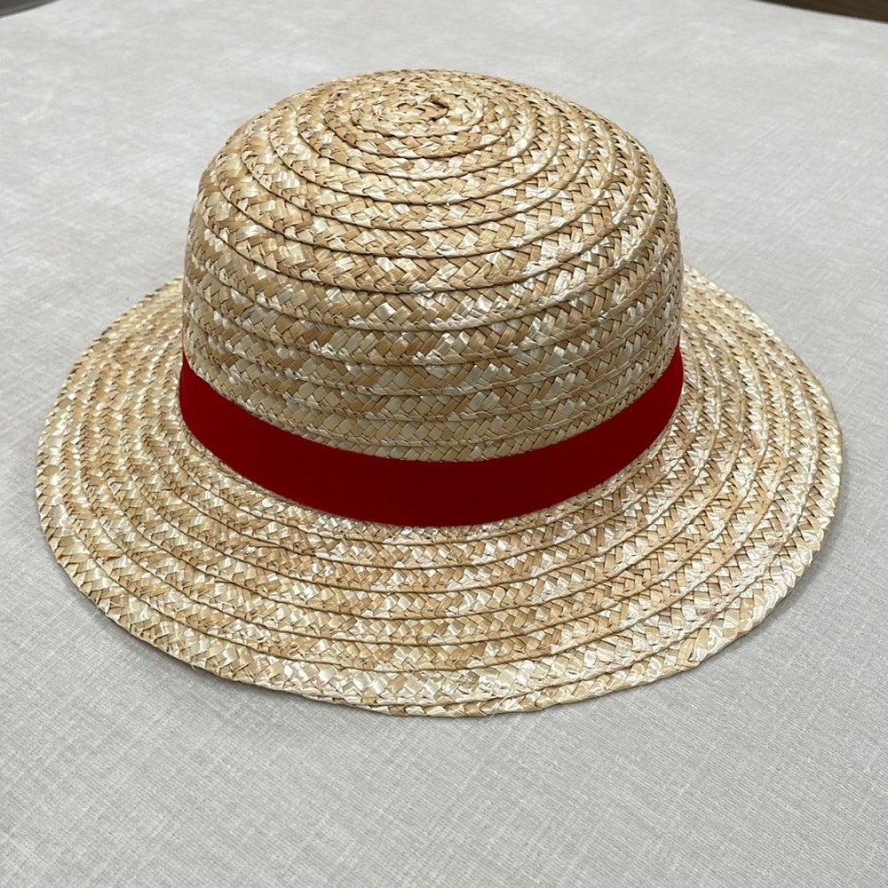 Straw hat with red ribbon